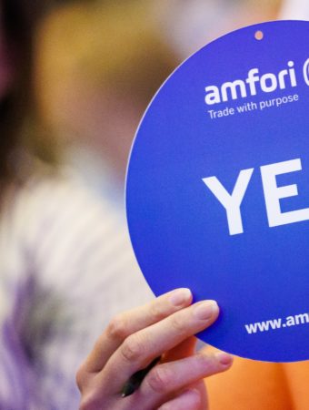 One person showing a card with a "yes" sign