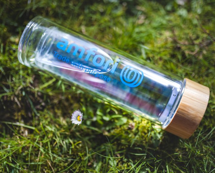 a water bottle in glass with amfori logo